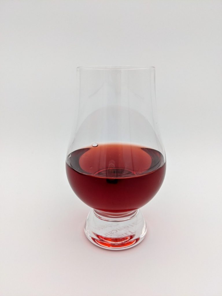 Dark Red liquid in a glencairn glass