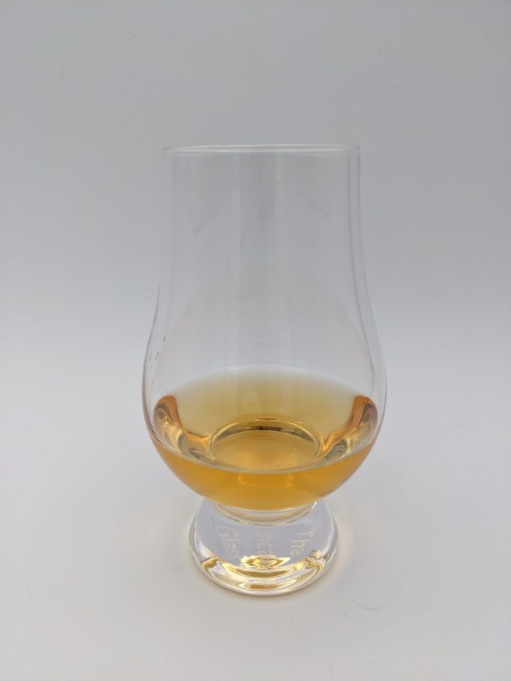 yellow gold liquid in a glencairn glass