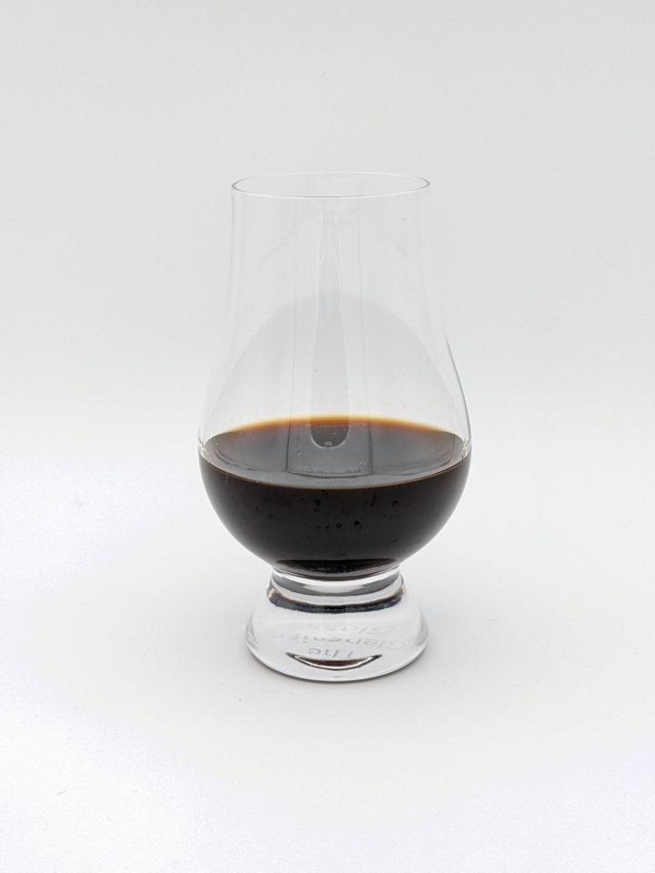 black liquid in a glencairn glass