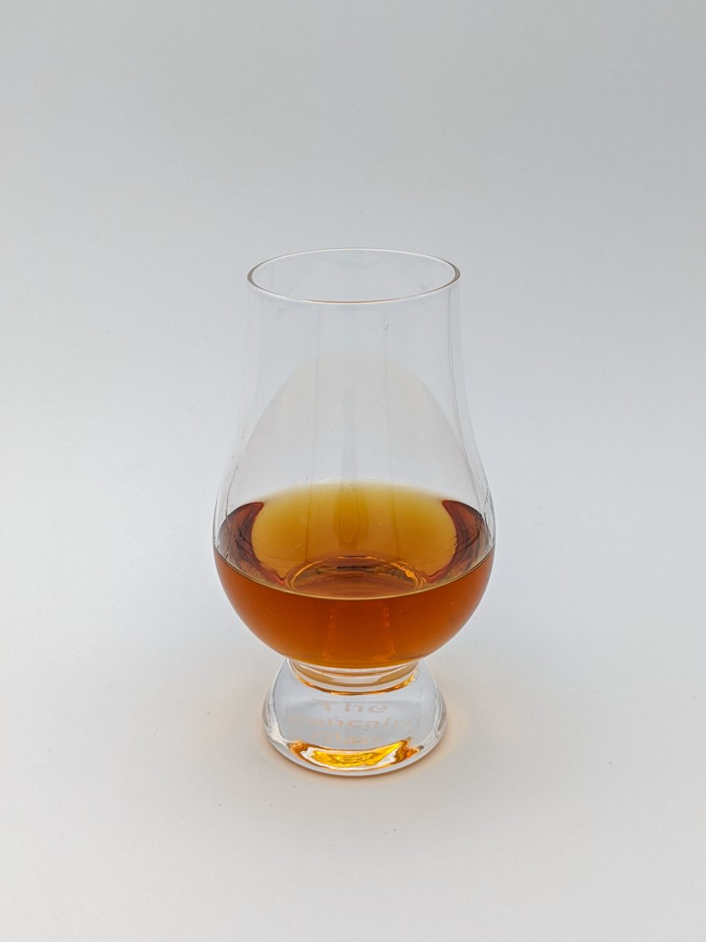 amber colored liquid in a glen cairn glass