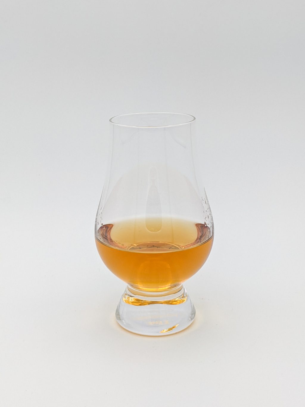 golden liquid in a glencairn glass