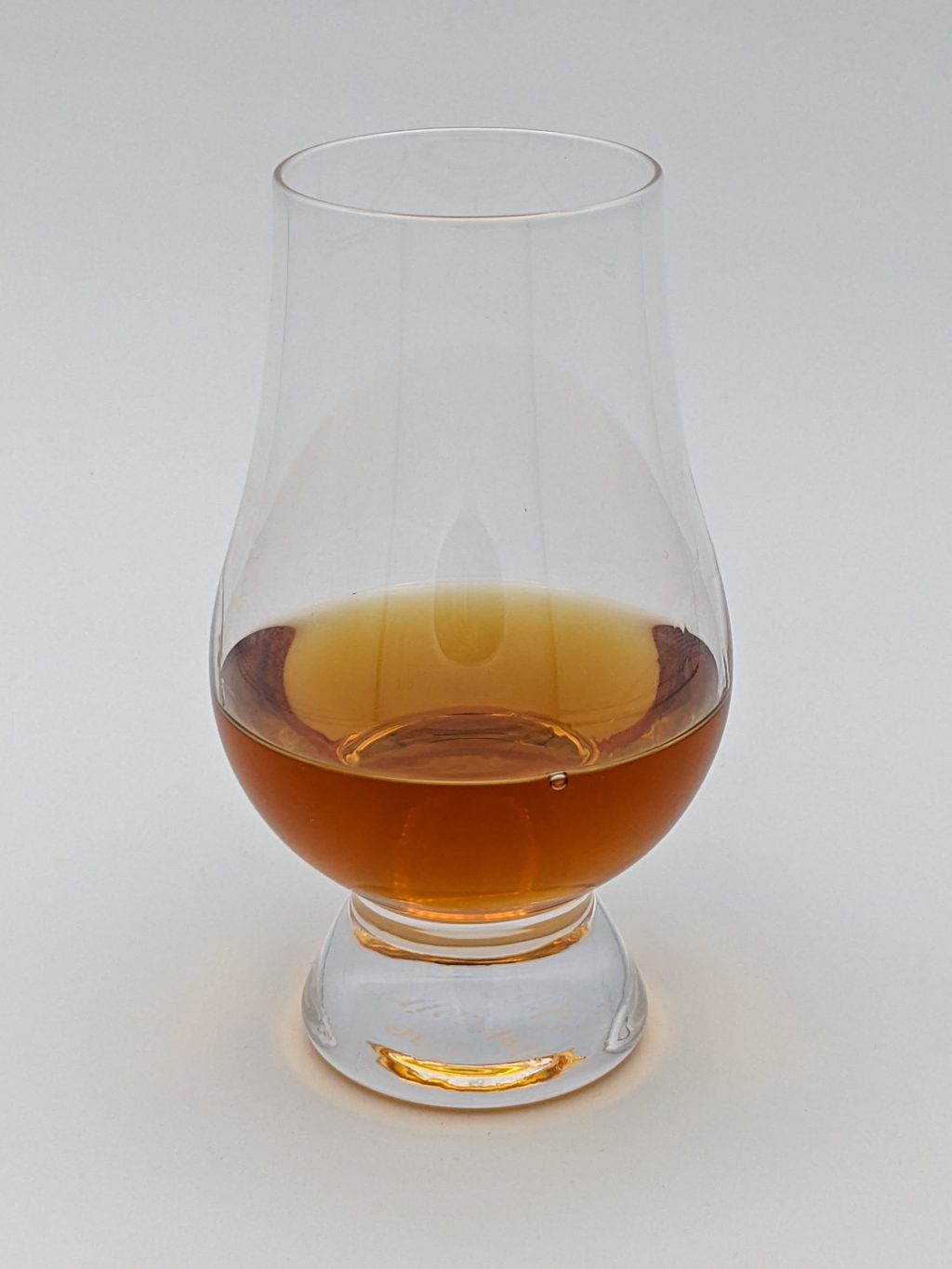 dark brown liquid in a glencairn glass