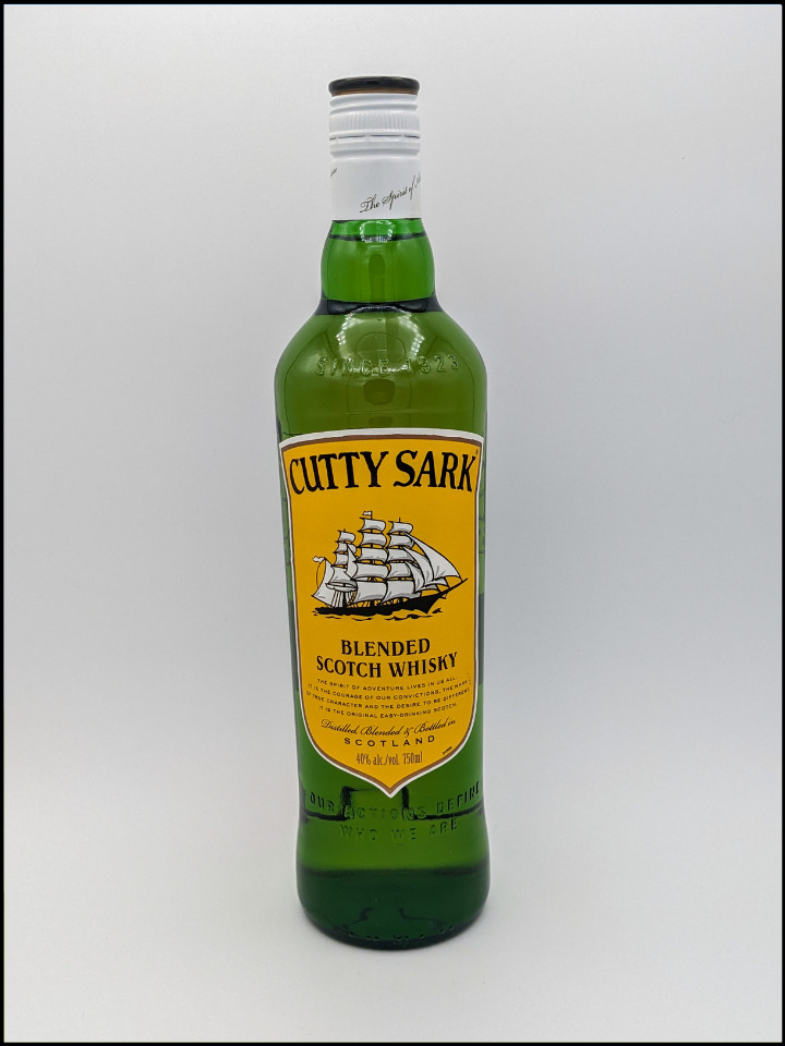 Tall Green bottle with a white top and Yellow label
