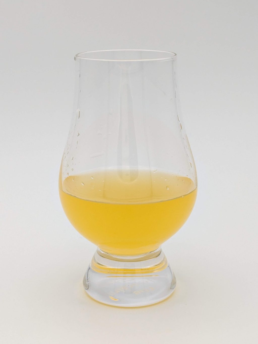 orange liquid in a glencairn glass