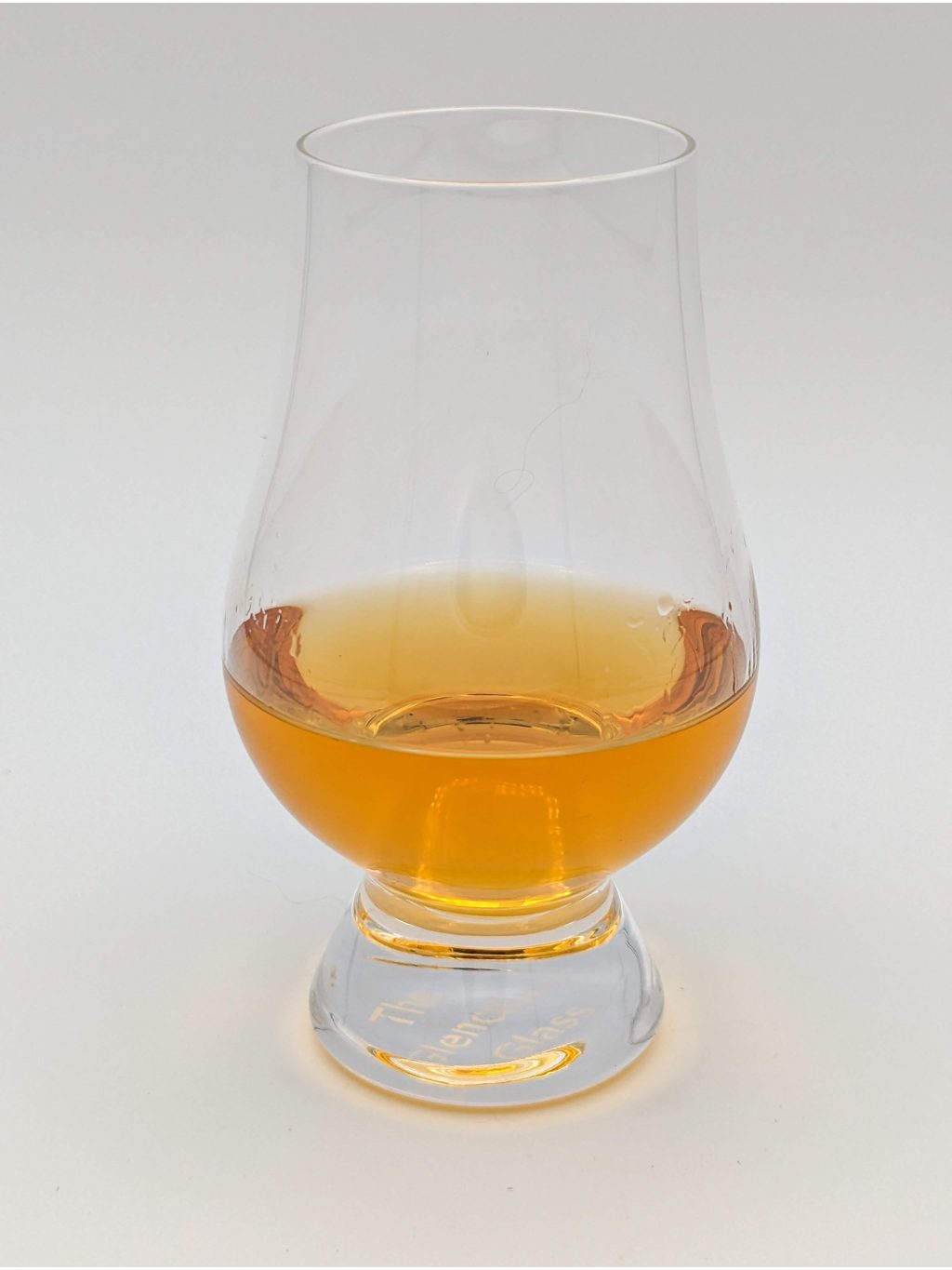 Honey colored liquid in a glen cairn glass