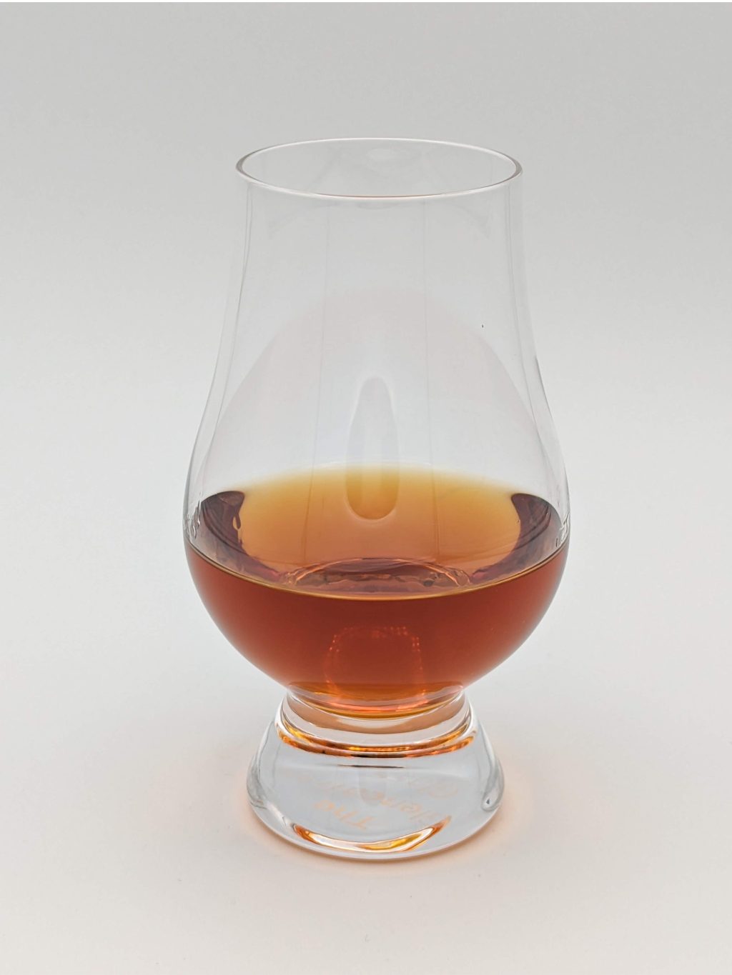 Dark amber liquid in a glen cairn glass
