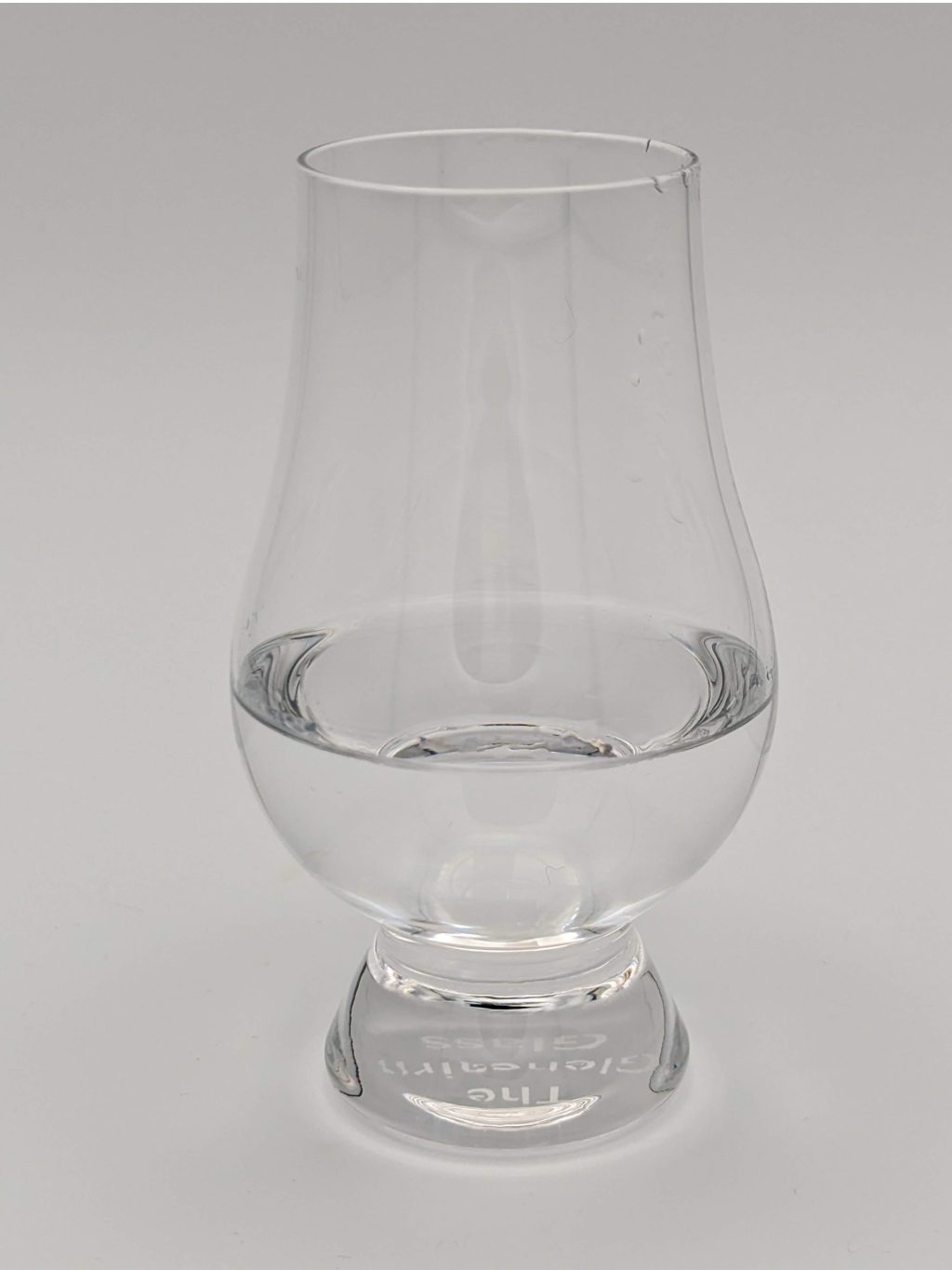 clear liquid in a glencairn glass