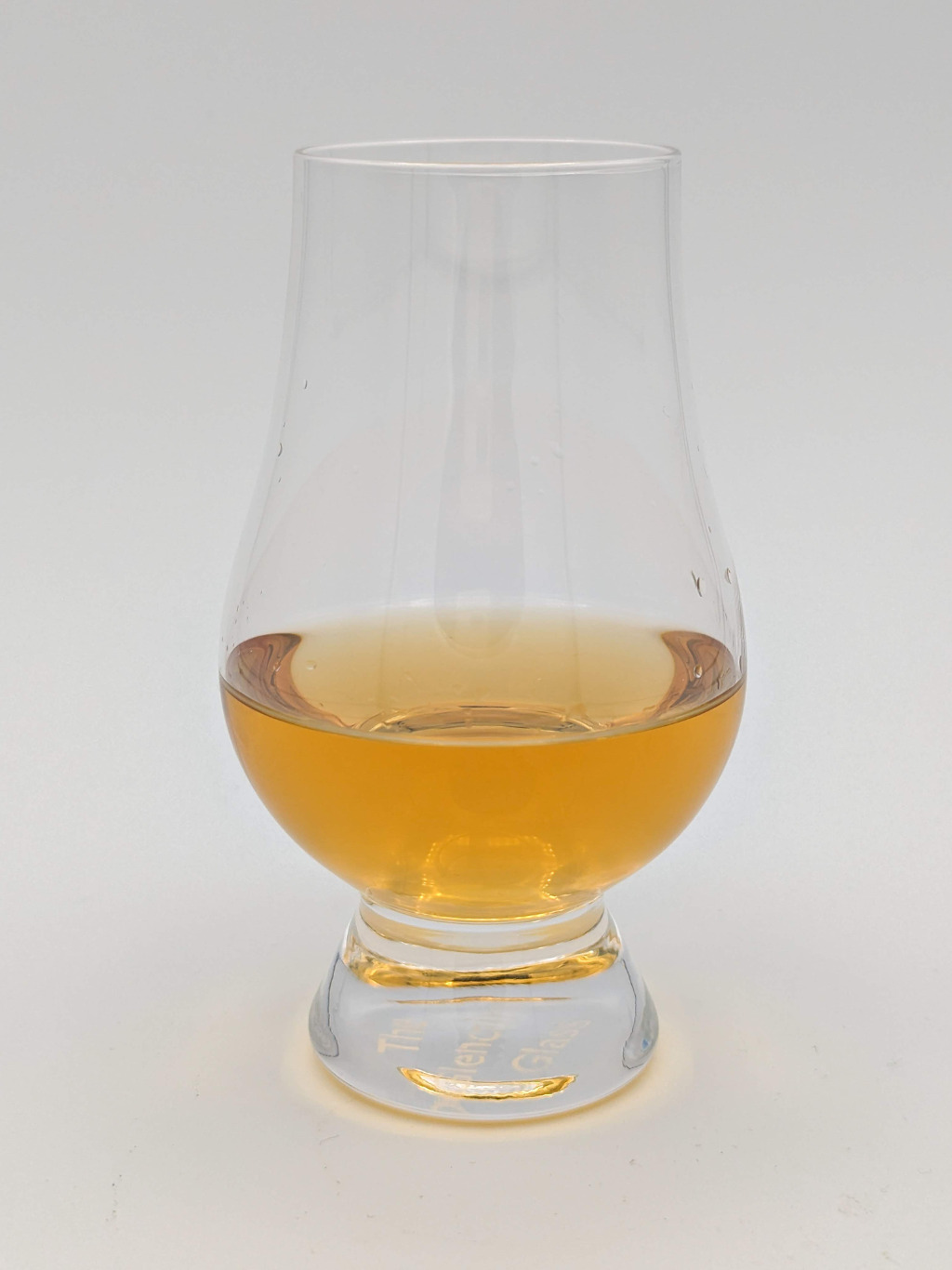 Gold Liquid in a Glencairn glass