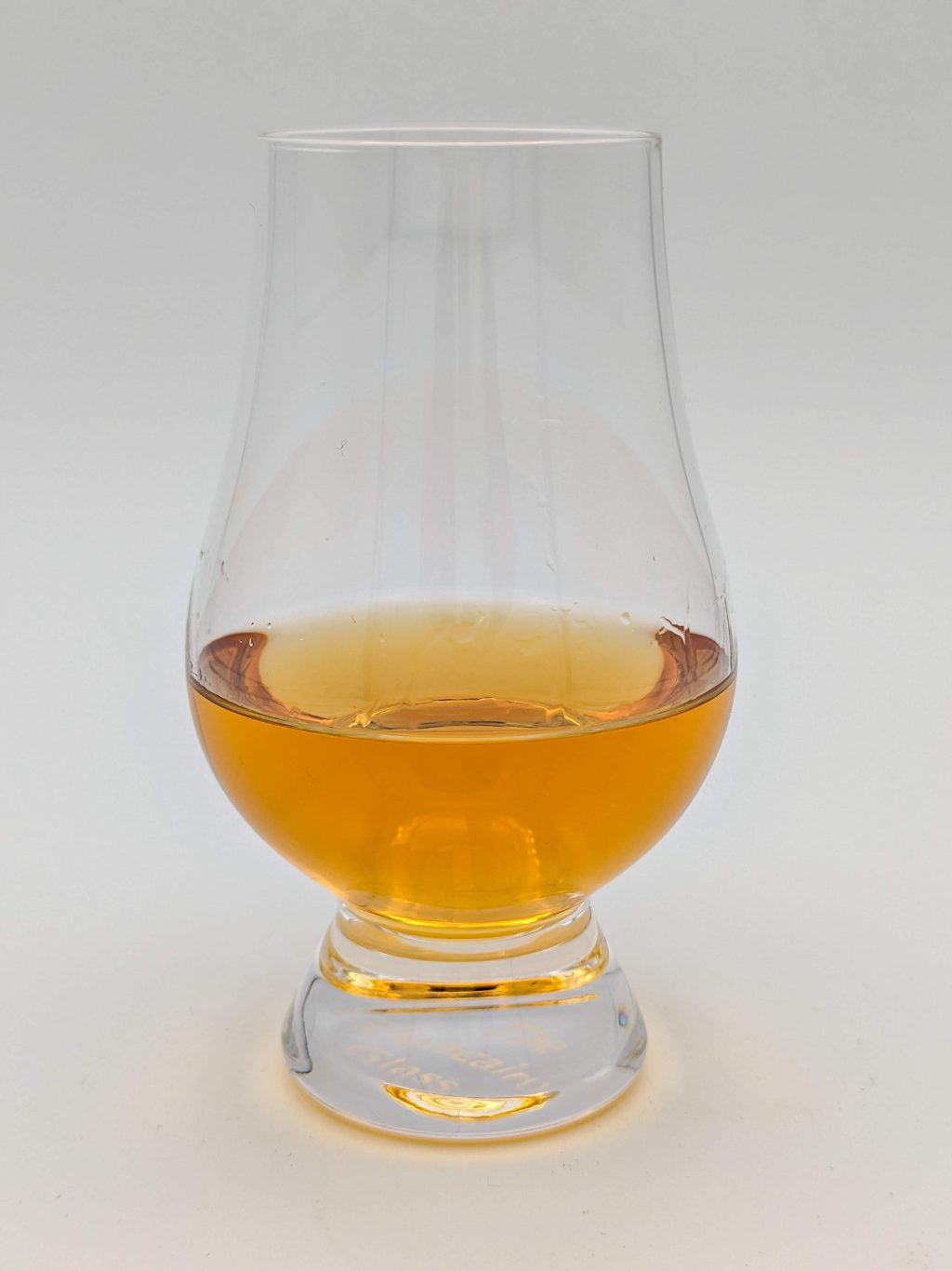 golden brown liquid in a glencairn glass