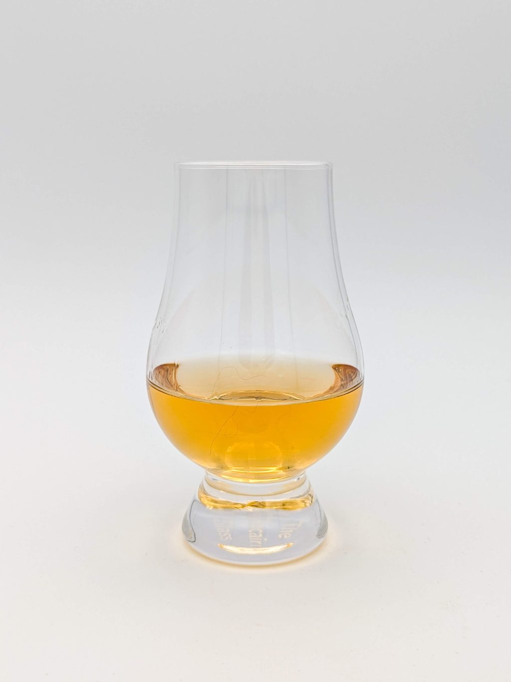 gold liquid in a glencairn glass