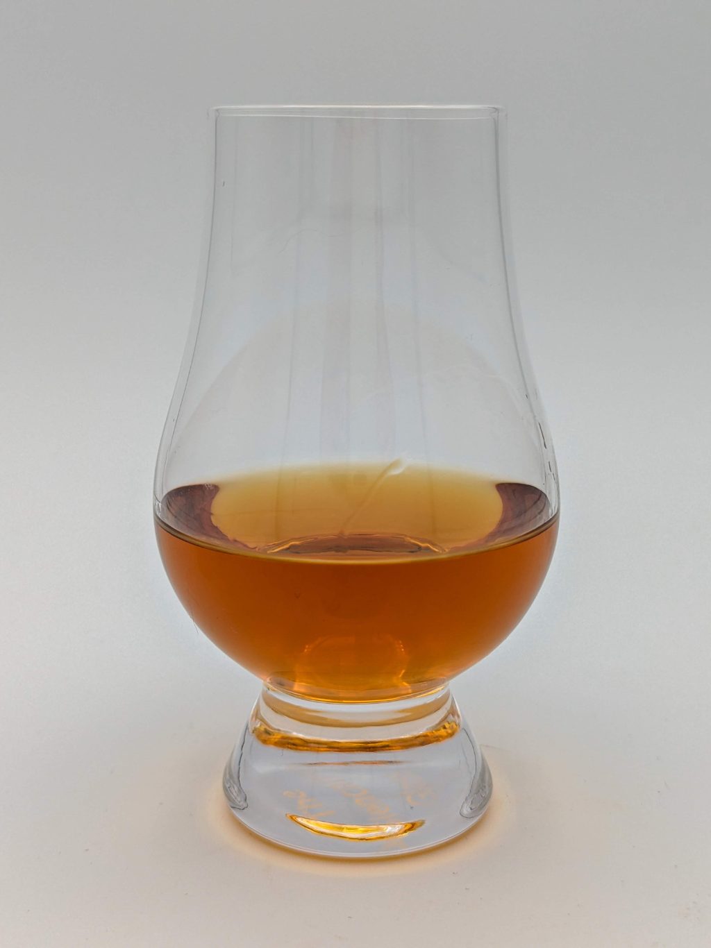 amber liquid in a glencairn glass